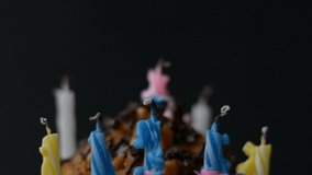 birthday celebration concept, festive cake with candles on a black background