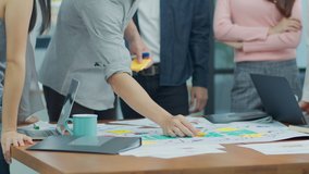 Close up Hands of asian creative employee standing and brainstorming stategy plan in happy workshop at creative workplace. Effective meeting, productive finance workshop and synergy business concept - Powered by Shutterstock - Get 15% off with code: PIKWIZARD15