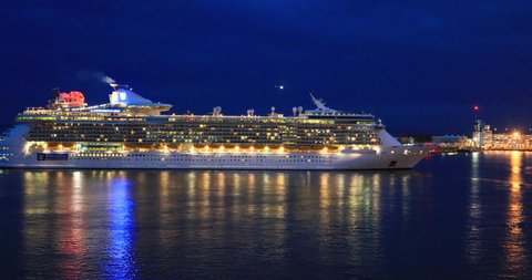FT LAUDERDALE, FLORIDA - 20 APR 2019: Fort Lauderdale Florida industrial harbor night cruise ship. Cruise ships, nautical marine recreation revenue by tourism. Cargo ship port, research conservation.