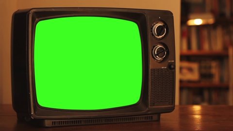 Old TV Set with Green Screen. Zoom In. Red Tone. You can Replace Green Screen with the Footage or Picture you Want with “Keying” effect in After Effects (check out tutorials on YouTube).