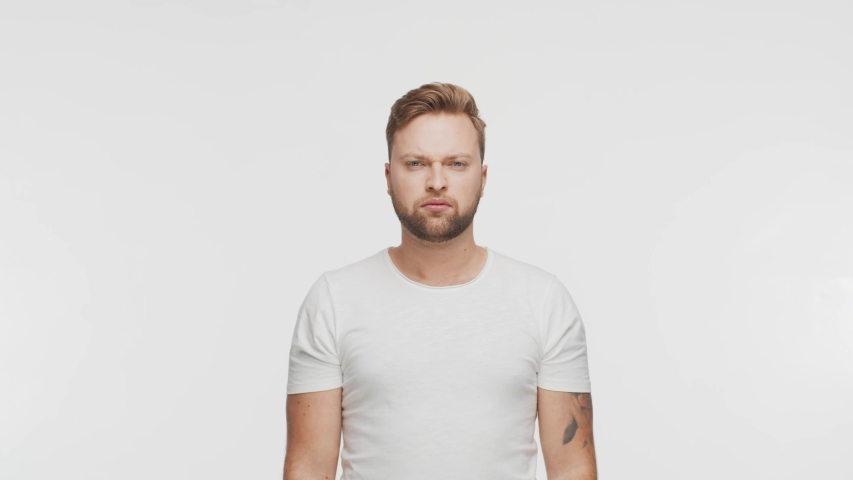 Expressive young man over vibrant background. Portrait of handsome person.