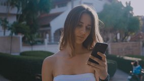 Portrait of a shocked young woman using a mobile phone. HD Time Lapse Emotion Footage. 4k