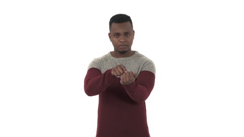 Handsome African American demonstrating middle finger. Fuck you gesture. Isolated, on white background
