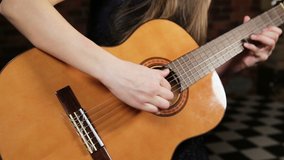 video of girl playing the guitar