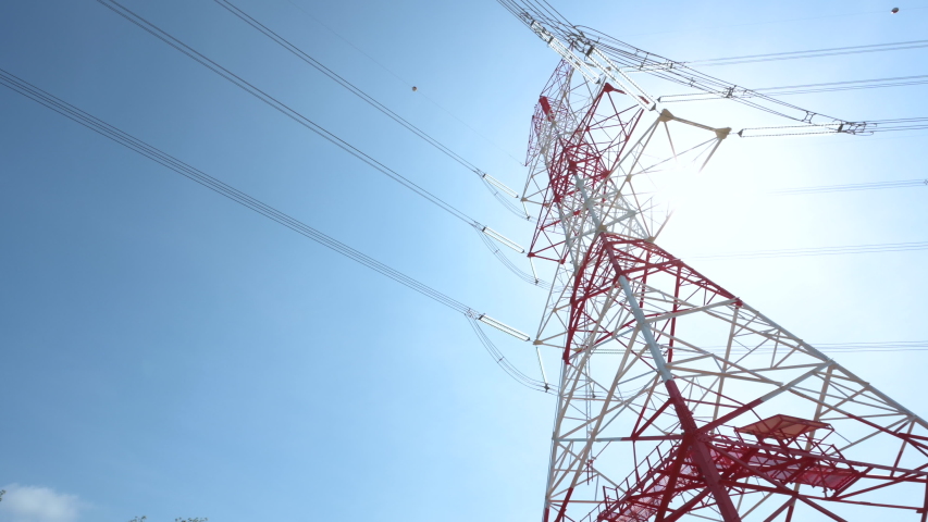 4K Prores of red and white color high voltage pole and blue sky, panning and rolling Royalty-Free Stock Footage #1046974285