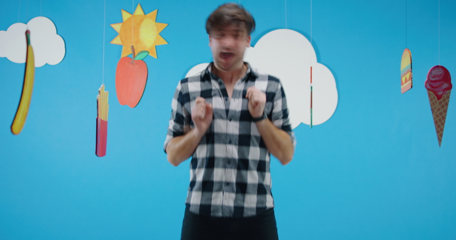 Medium shot of a man expressing love for unhealthy fast food