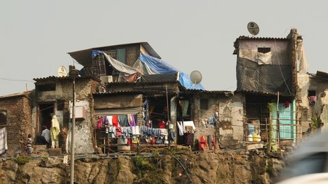 Mumbai, India, January 2020. Slum house with colorful laundry.