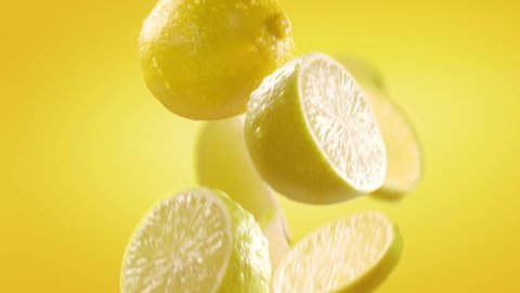 Flying of Lemon and Slices in Yellow Background
