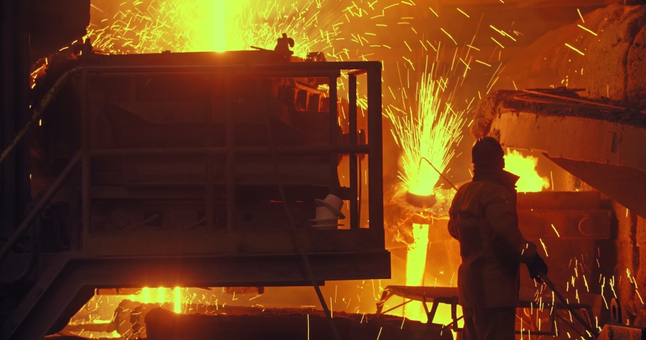 Hard work in a foundry. Metal smelting furnace in steel mill. Molten metal pouring, metallurgy, steel casting foundry. Steel manufacturing Royalty-Free Stock Footage #1046998783