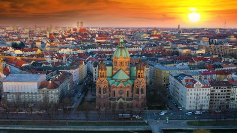 Munich Skyline Aerial view of Old town, fly over Isar River und St. Luke's Church, in backgorund Frauenkirche Church, Town Hall, Tv tower Munchen Germany. Video Stok