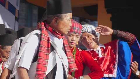 Sauraha, Chitwan, Nepal. 1/1/2020. Slow motion close up of Gurung men and woman dancing with instruments and nepali Topi hat.