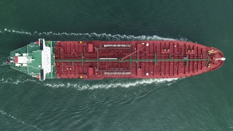 Birdview/aerial shot of an oil tanker entering the port of Rotterdam
