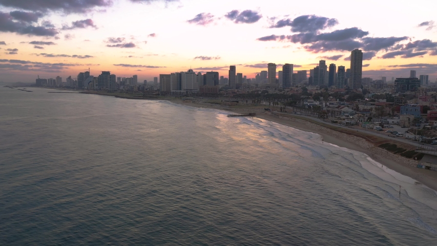 Flight toward Tel Aviv from Jaffo during a summer sunrise as the modern metropolis awakes in Israel