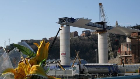 Genoa, Italy - January 23th 2020: Bridge under construction with flowers in memory of the dead of the collapsed Morandi bridge 