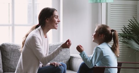 Female speech language therapist teaching preschool kid sound pronunciation, stuttering cute child having stutter;  voice ability problem speaking lesson concept