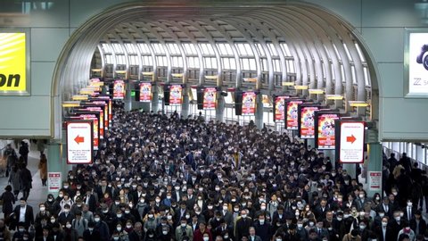 Tokyo, Japan-04 February, 2020: Aerial view of congestion peoples on working days morning in city metro station. Crowded of Japanese people in subway early morning. Japanese passengers walked.-Dan