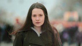 Close up one woman feminist face looking at camera stand street city. People feminism face portrait closeup. Confident serious. Adult young sad girl rebel. Independent lady fight strike revolution. - Powered by Shutterstock - Get 15% off with code: PIKWIZARD15