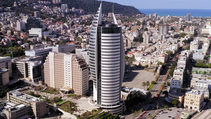 Haifa, Israel - January 12, 2020: Aerial view of Downtown Haifa, Israel, showing the city skyline with business district and commercial port.