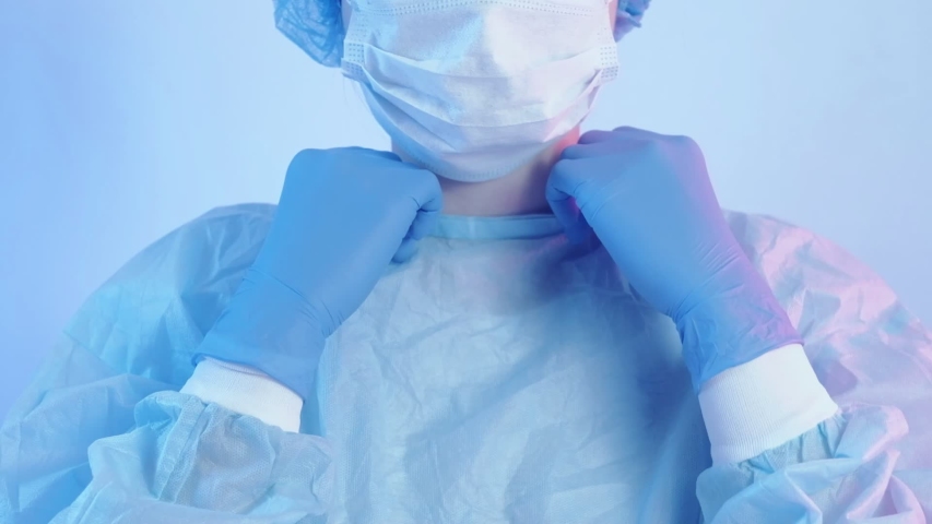 Virus epidemic breakout. Nurse wearing medical personal protective equipment. Royalty-Free Stock Footage #1047059455