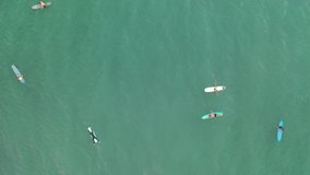 a lot of surfers in the ocean catch a wave, surfing
