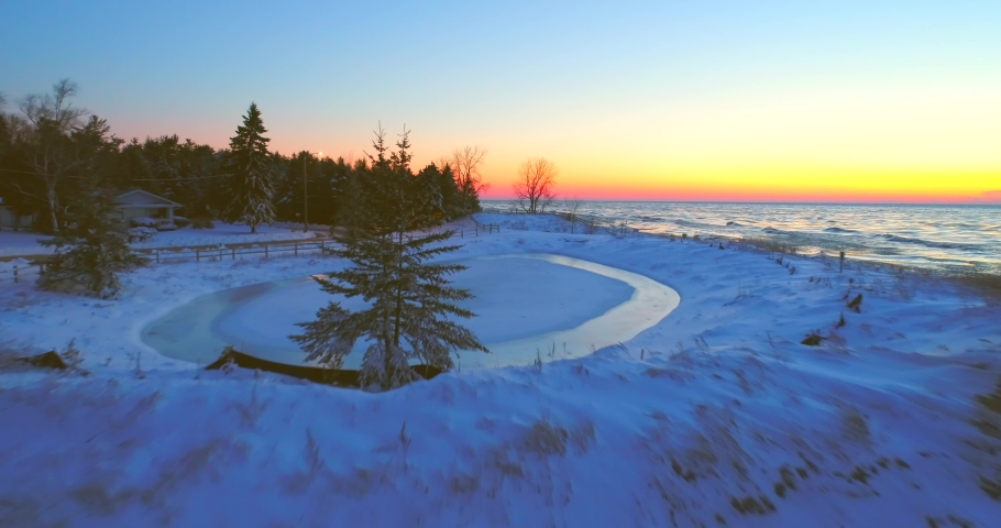 Exceptionally scenic Winter landscape on Lake Michigan shoreline, at sunrise, aerial view.
