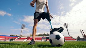 Paralympic football player is dribbling the ball - Powered by Shutterstock - Get 15% off with code: PIKWIZARD15