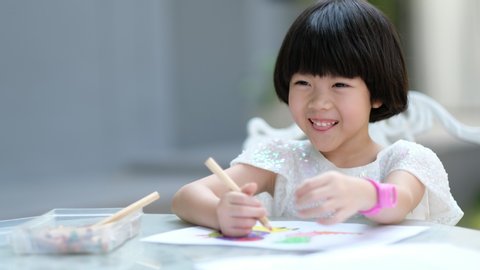 girl doing homework, kid writing paper, education concept, back to school
 库存视频