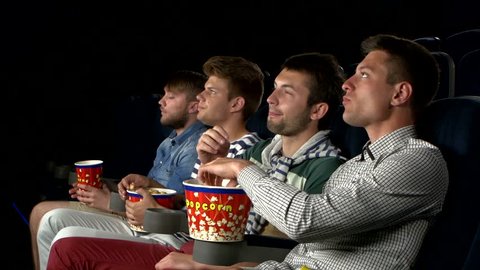 eating popcorn at the movies