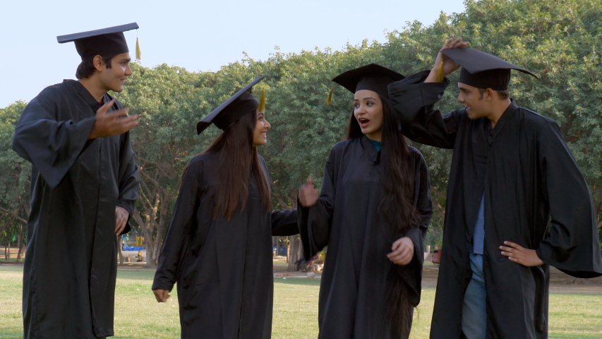 Young happy graduates throwing their graduation hats in the air - celebration time. Group of excited Indian students tossed their academic hats into the air while celebrating their graduation day -... Royalty-Free Stock Footage #1047111787
