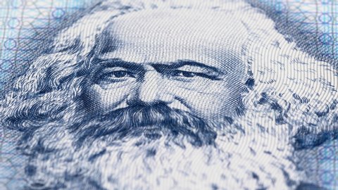 Karl Marx portrait on East German banknote tracking. Slider shot. Low angle, macro. 4K