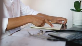 The doctor recorded the patient's treatment in a notebook.Vaccination concept. laboratory, medical and healthcare.b roll Video - Powered by Shutterstock - Get 15% off with code: PIKWIZARD15