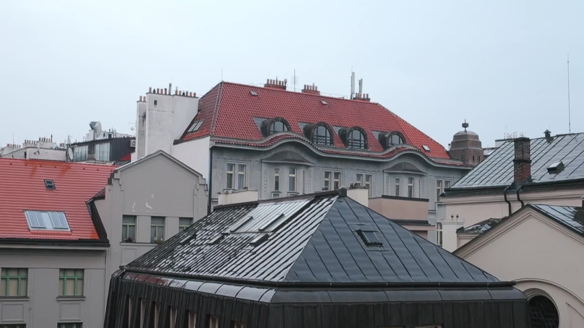 View on the roofs of houses of the old city of Prague` day.`` S````````mooth movement of camera. Jewish Museum in Prague Maisel Synagogue in Jewish Town in Prague Czech republic. 