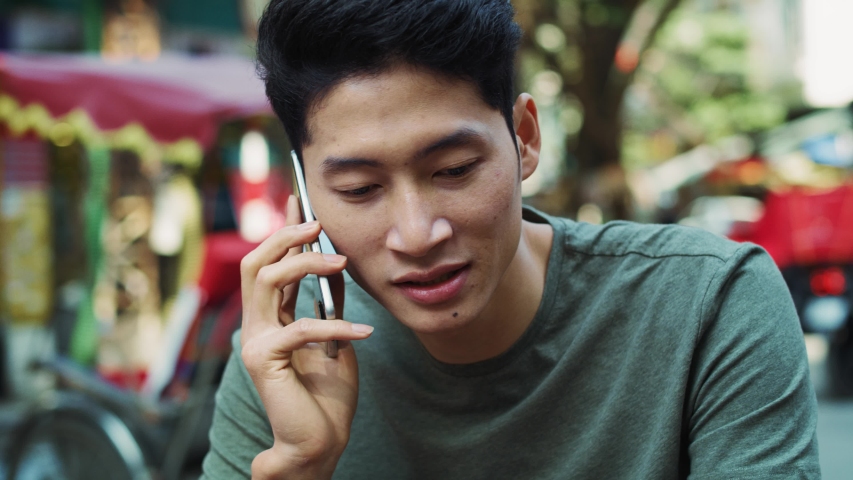 handheld view vietnamese man on phone Stock-video (100 % royaltyfri) 104712...