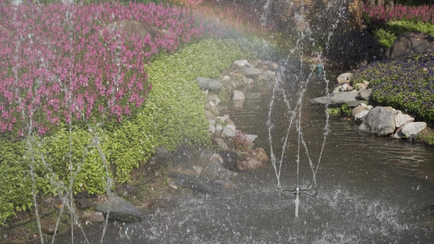 Spinning jet fountain at public flower garden in Thailand
