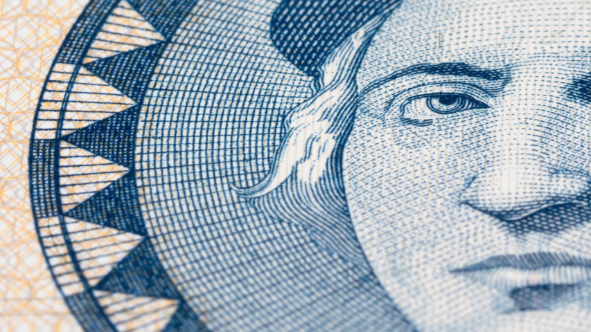 Christopher Columbus portrait on Bahamas 1 dollar banknote tracking. Dolly shot. Low angle, macro. 4K