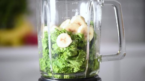 Detox and healthy lifestyle concept. Fruits, berries and greens blended into healthy green smoothie. Vegan, vegetarian diet. Breakfast preparation