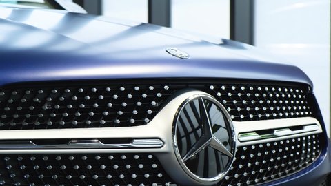Moscow, Russia - February, 2020: Mercedes-Benz logo on the hood and radiator grille of a blue car