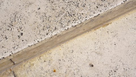 Surface of a step of a Roman travertine staircase