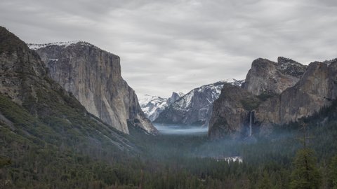 Yosemite Valley Tunnel View on Cloudy Day. El Capitan and Half Dome. California, USA. Time Lapse. Zoom In