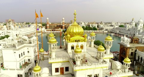 High jib up over golden tower revealing the Nectar pool in the Golden temple, Amritsar.