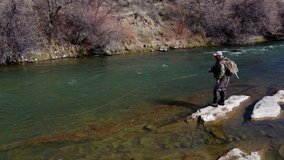 a 4k high definition clip of a man fly fishing on the San Jaun River in New Mexico.