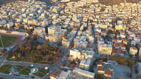 Aerial drone Flight descending to mitilini,city center houses turning to hills and mountains, mytilene lesvos, greece