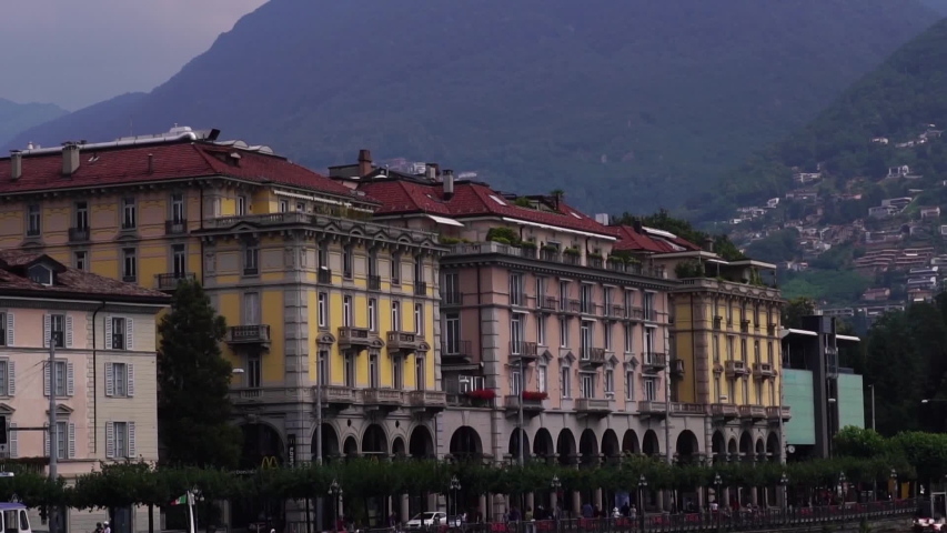 Lake Lugano building. Lugano Ticino, Switzerland summer tourism. Swiss Alps. slow motion. 