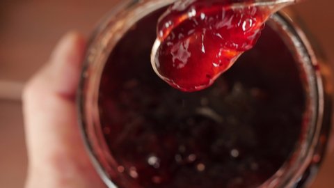 red strawberry jam, raspberry in a jar