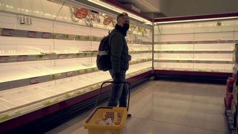 Milan Italy February 25, 2020: Empty shelves in grocery stores. Panic from the Chinese Covid19 virus corona in Italy. People bought all the meat and pasta. Quarantine in Milan. Epidemic. Panic