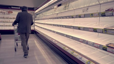 Milan Italy February 25, 2020: Empty shelves in grocery stores. Panic from the Chinese Covid19 virus corona Wuhan. People bought all the meat and pasta. Quarantine in Milan. Epidemic. Panic