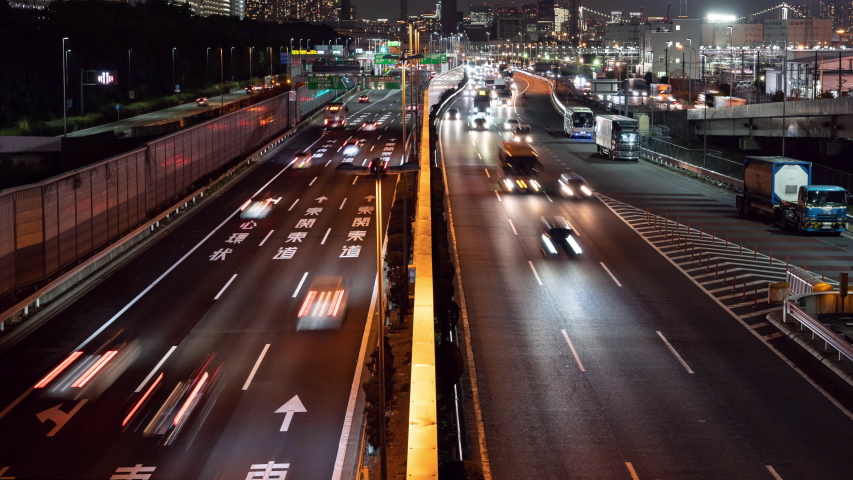 Time-lapse Video of Highway Traffic in a Big City (Zoom In): Tokyo, Japan (Translations: East Kanto Freeway, Chuo Freeway, Inner Circular Route) Royalty-Free Stock Footage #1047207844
