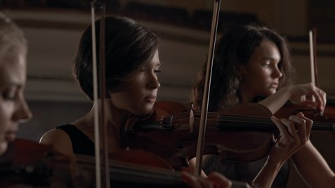 Team of Three Music Players with Classic Wooden Violins. Enjoy Calm Emotions of Women Trio Playing Acoustic Melody Indoors. Activity of Pretty Woman as Violinist or Skill of Talented Musician Closeup