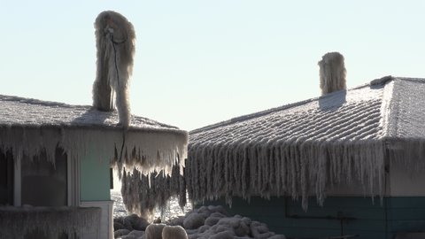 Chatham, Ontario, Canada February 2020 Ice storm and freezing rain spray coats houses in ice