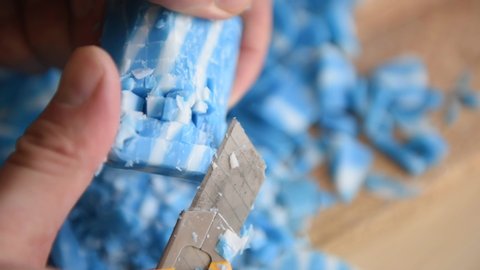 blue and white soap cuts with a knife